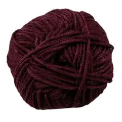 Ball of dark red yarn on a white background